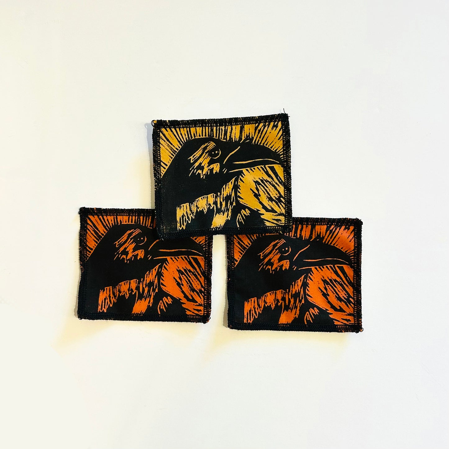 hand printed patch of a crows head