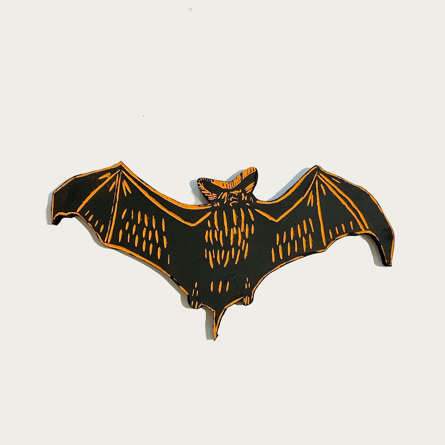 Orange and Black Wooden Bat Wall Hanging